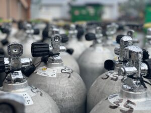 Array of metal scuba tanks,